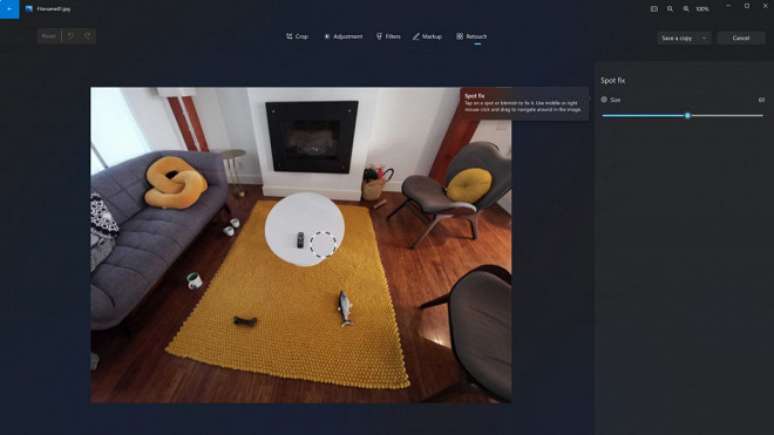 Captura de tela do novo recurso spot fix no app Fotos para Windows 11 para corre&ccedil;&otilde;es de manchas ou objetos indesejados nas fotos.