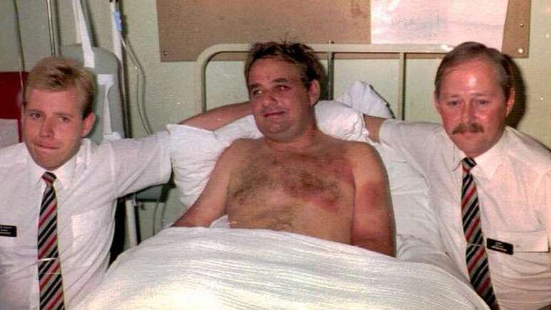 Tim Lancaster, ao lado de Simon Rogers (esq.) e Nigel Ogden (dir.)