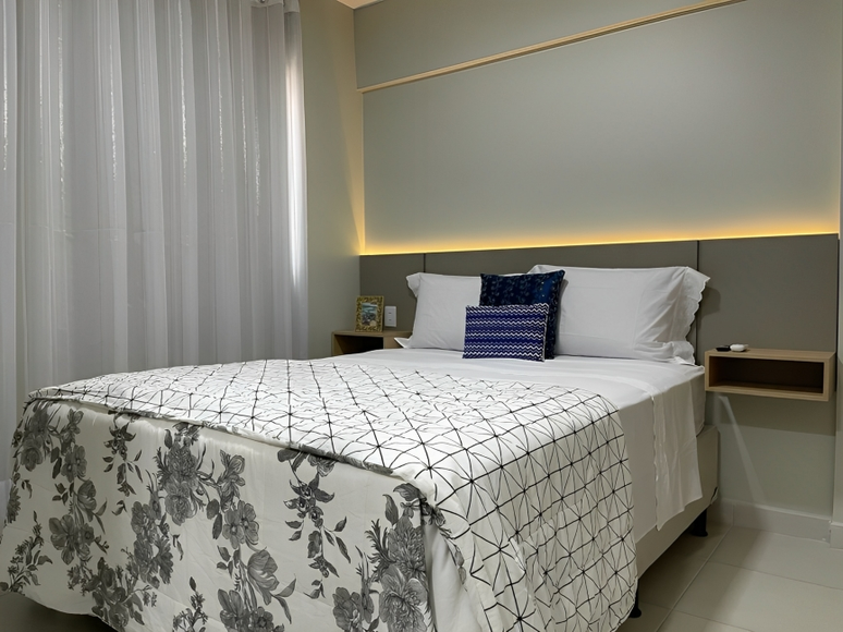 The photo shows a bedroom with a double bed.