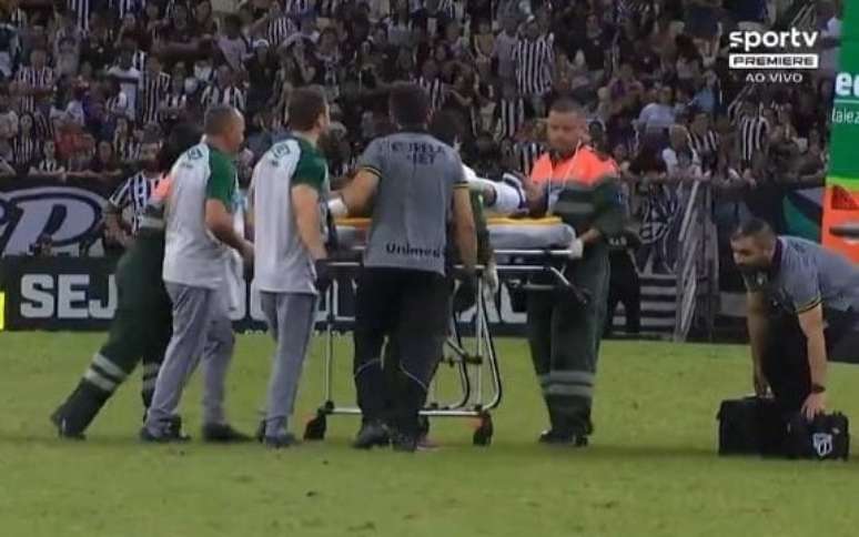The Chapecoense midfielder collapses after the shock and is removed from the field in an ambulance