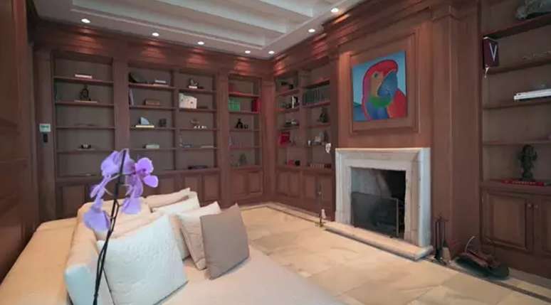 One of the rooftop rooms has wood paneled walls and a fireplace. One of the rooftop rooms has wood paneled walls and a fireplace.