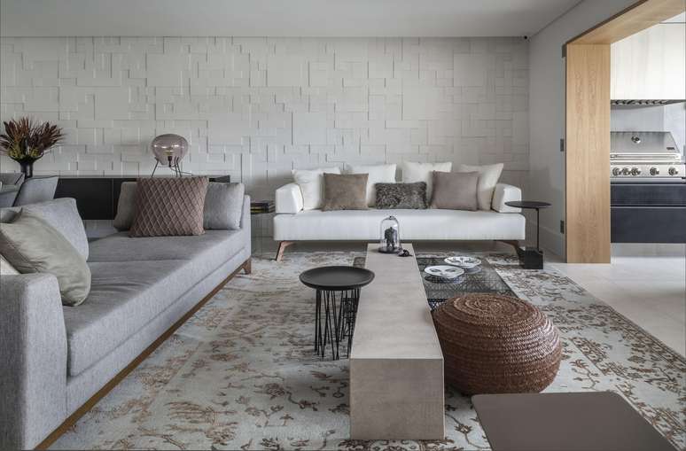Porcelain, concrete cladding and neutral tones distinguish the 260m2 apartment