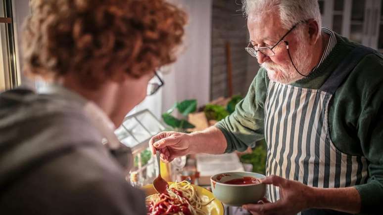 Young students and older people living together can enjoy benefits such as social ties and lower house prices