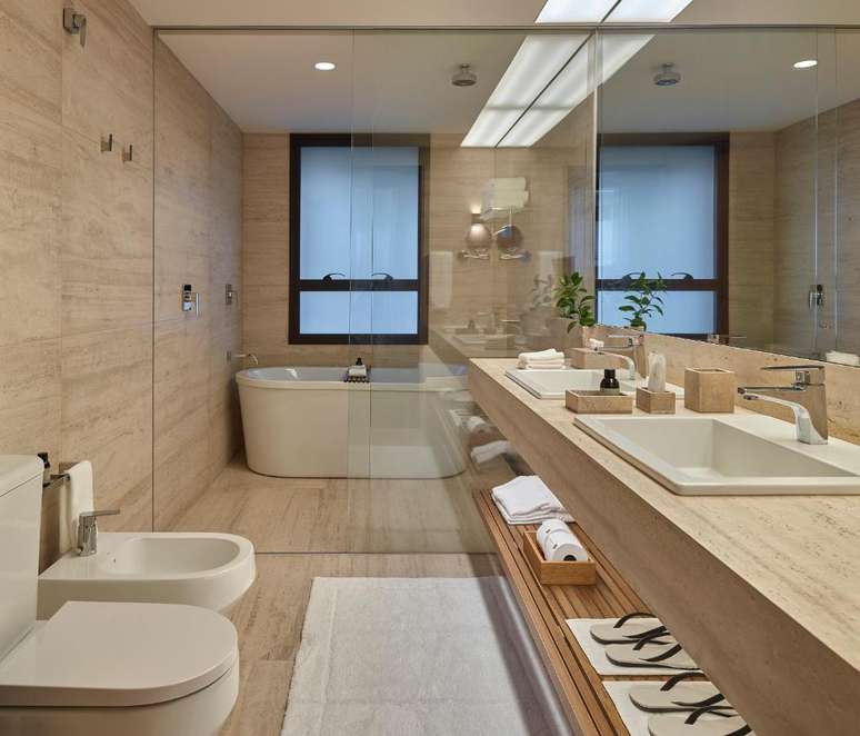 Travertine marble, phenomenal shower, and stellar amenities by Costa Brasile