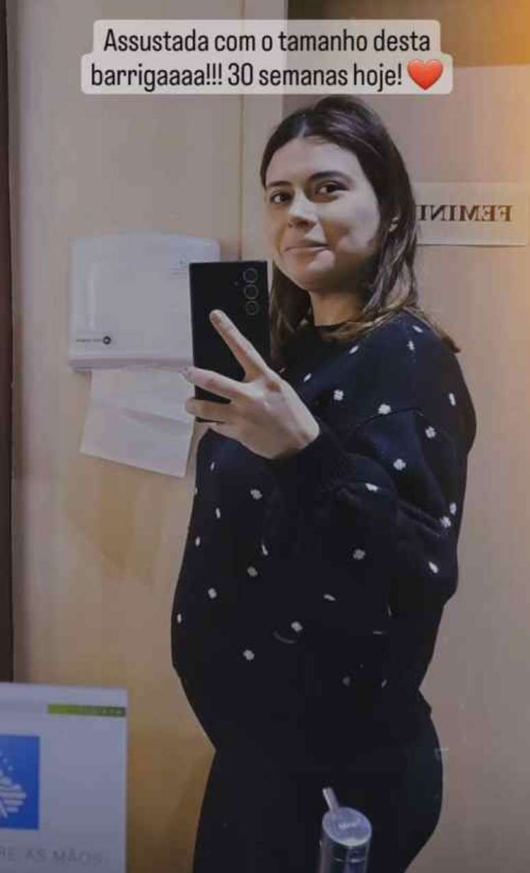 Very pregnant, Michelle Loreto is surprised by the size of her belly