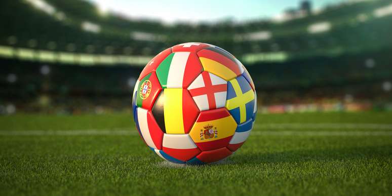 Football with flags of European countries on the grass of the football field.  Euro 2021