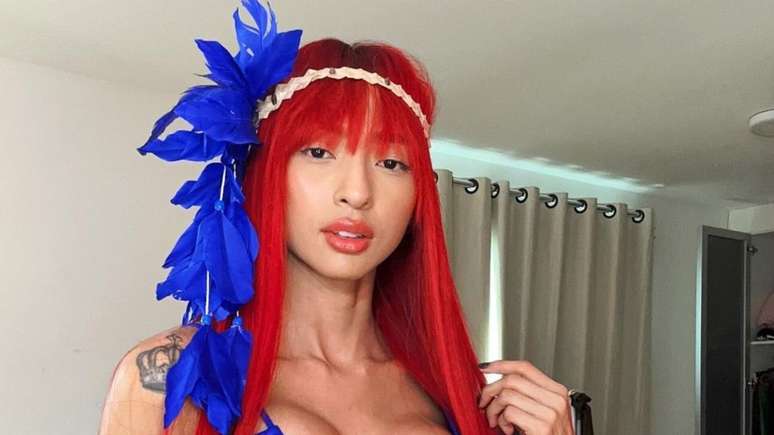 The redhead from Mars poses in a thin bikini and impresses fans