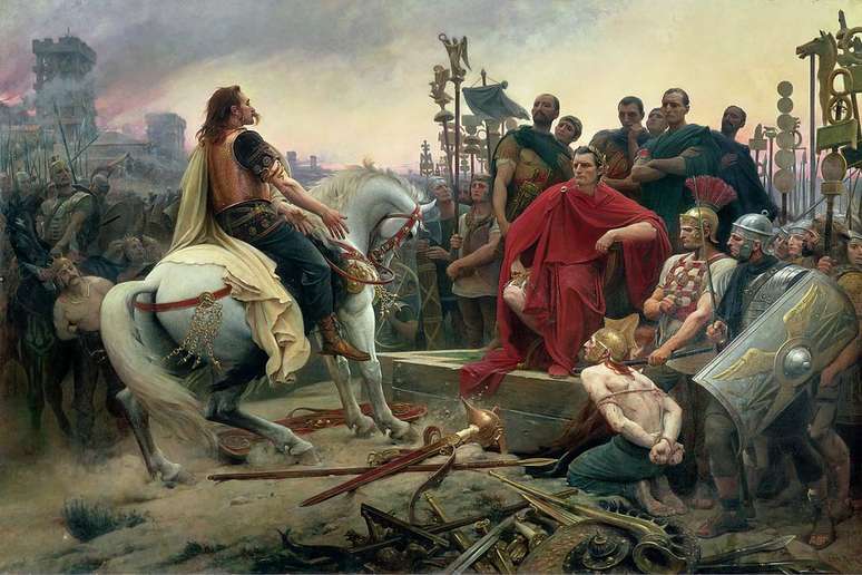 César ganhou poder e fama na Guerra da Gália: na pintura, ele aceita a rendição de Vercingetórix, líder dos gauleses (Imagem: Lionel Royer/Domínio Público)