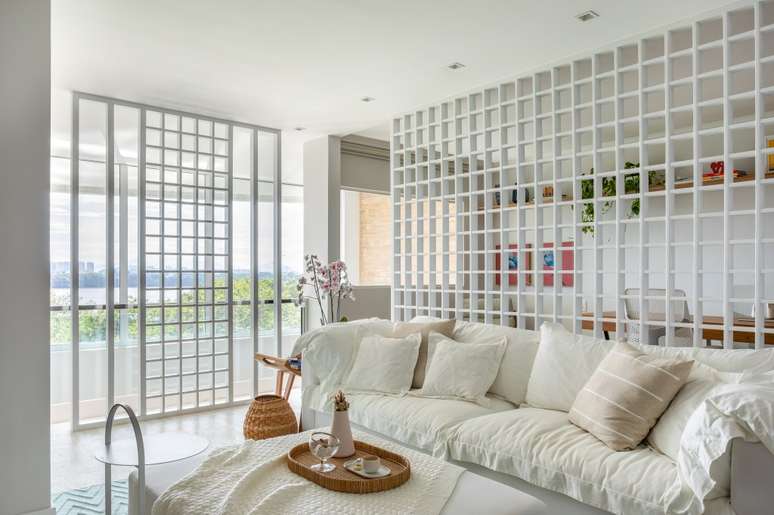 White living room with hollow muxarabis partition walls and white sofa. White living room with hollow muxarabis partition walls and white sofa.