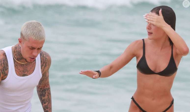 Focused girl!  Jade Picon works out and shows off her smooth crotch in a string bikini during workout on the beach and gets stares from MC Daniel.  Look at the pictures!