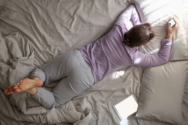 Can curling up too much or spending the day in bed be harmful?