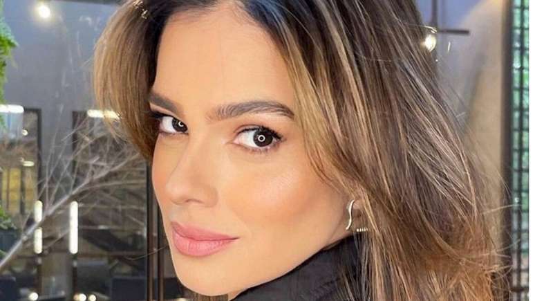 Vera Viel shows off her toned body while posing in the pool of her luxury villa