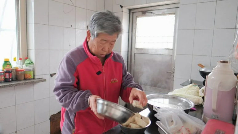 Cao and his wife say they don't want to leave their village to live in the city