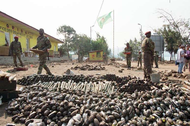 Rwandan soldiers in front of the remains of the victims of the genocide Rwandan soldiers in front of the remains of the victims of the genocide