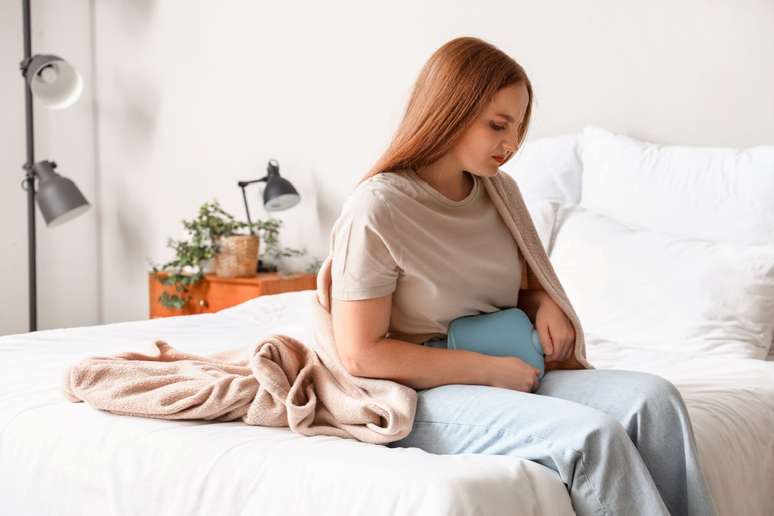 The hot water bottle helps relieve menstrual cramps The hot water bottle helps relieve menstrual cramps