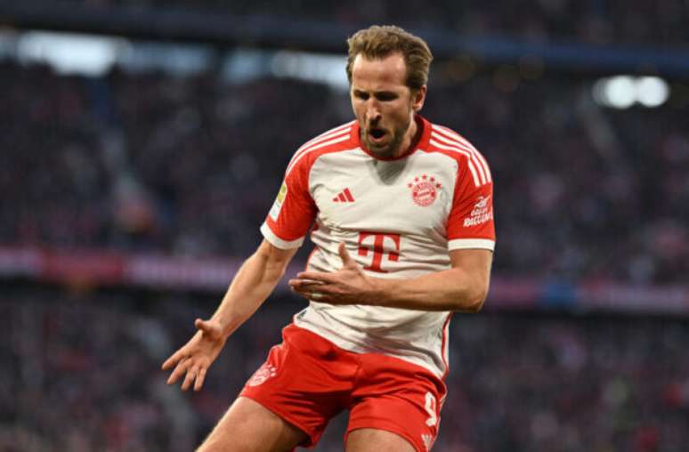 Ian Kington/AFP via Getty Images - Legenda: Harry Kane marcou 36 gols em sua primeira temporada na Bundesliga -