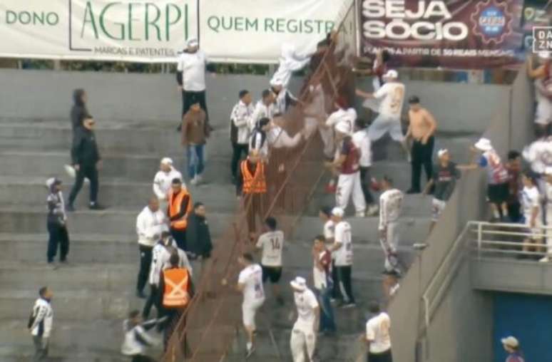 The fans of Caxias and Figueirense face each other at the stadium in a Serie C match