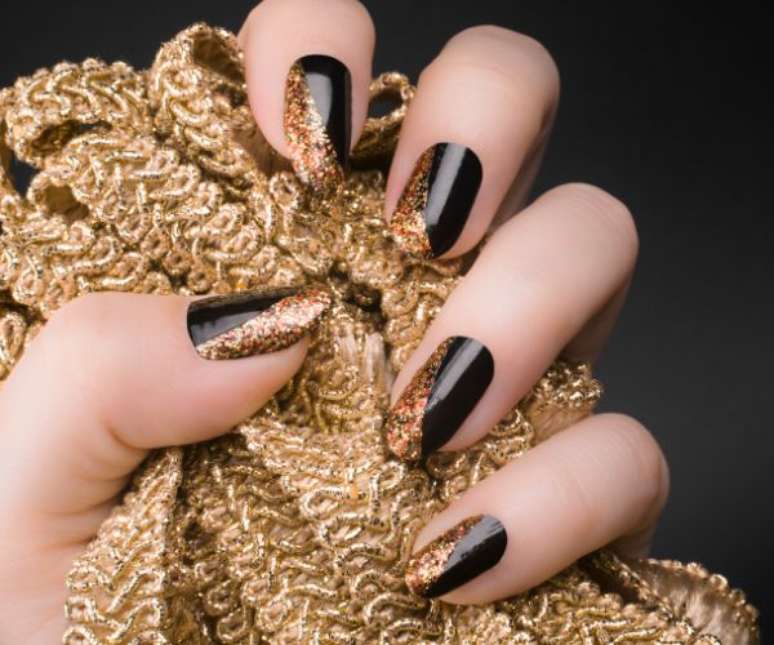 Glitter Adds a Pop to Black Nails – Shutterstock Glitter Adds a Pop to Black Nails – Shutterstock