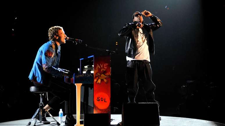 Os fãs e colaboradores do Coldplay incluem Jay-Z (foto no palco com Chris Martin), Stormzy e Nick Cave.