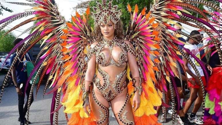 Carnival? Rihanna parades with feathers and stones