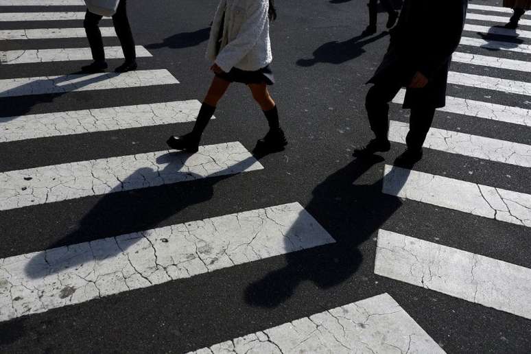 Pedestres em Tóquio, Japão 
15/02/2024
REUTERS/Issei Kato