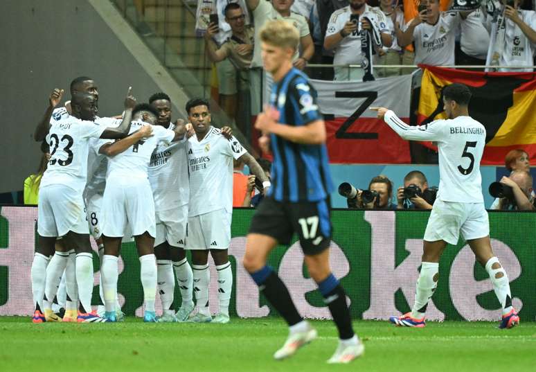 Real Madrid's players celebrate scoring during the UEFA Super Cup football match between Real Madrid and Atalanta BC in Warsaw, on August 14, 2024. (Photo by Sergei GAPON / AFP) (Photo by SERGEI GAPON/AFP via Getty Images)