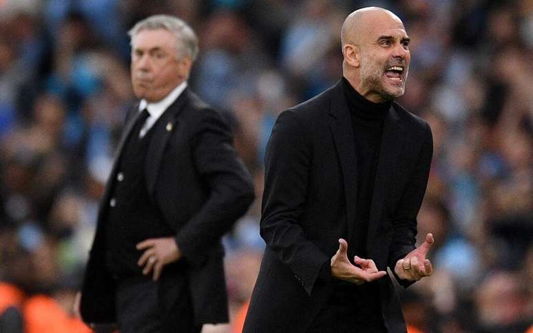 Carlo Ancelotti esquerda e Pep Guardiola direita, os dois últimos campeões da Champions, podem se enfrentar já na primeira fase da competição