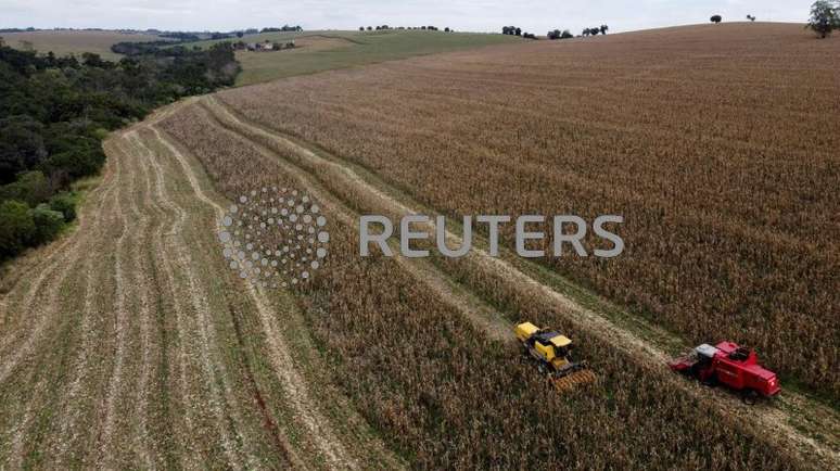 A farmer uses a machine to collect corn at a plantation in Maringa, Brazil, July 13, 2022. REUTERS/Rodolfo Buhrer