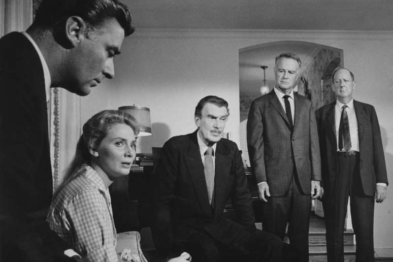 A scene from the film 'Advise & Consent', 1962. From left to right, Peter Lawford (1923 - 1984), Inga Swenson, Walter Pidgeon (1897 - 1984), Lew Ayres (1908 - 1996) and Paul Ford (1901 - 1976). (Photo by Columbia Pictures/Archive Photos/Getty Images)