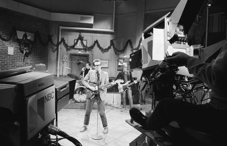 SATURDAY NIGHT LIVE -- Episode 8 -- Aired 12/17/1977 -- Pictured: Musical guest Elvis Costello performs -- (Photo by: NBCU Photo Bank/NBCUniversal via Getty Images via Getty Images)