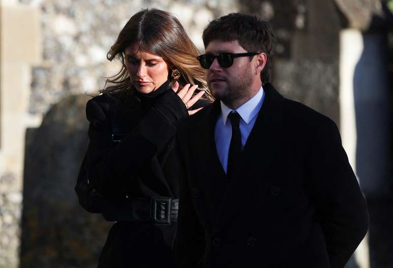     Niall Horan and Amelia Woolley leave after the funeral of former One Direction singer Liam Payne at St Mary's Church in Amersham, near London, Britain on 20 November 2024