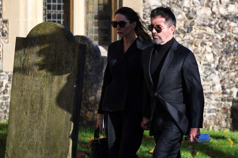 Simon Cowell and his wife Lauren Silverman walk on the day of former One Direction singer Liam Payne's funeral at St Mary's Church in Amersham, near London, Britain, 20 November 2024