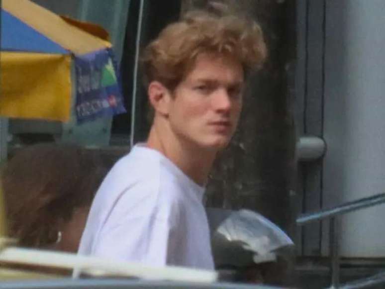 The ‘Girl of the Moment’ heartthrob frowns after being caught with his girlfriend