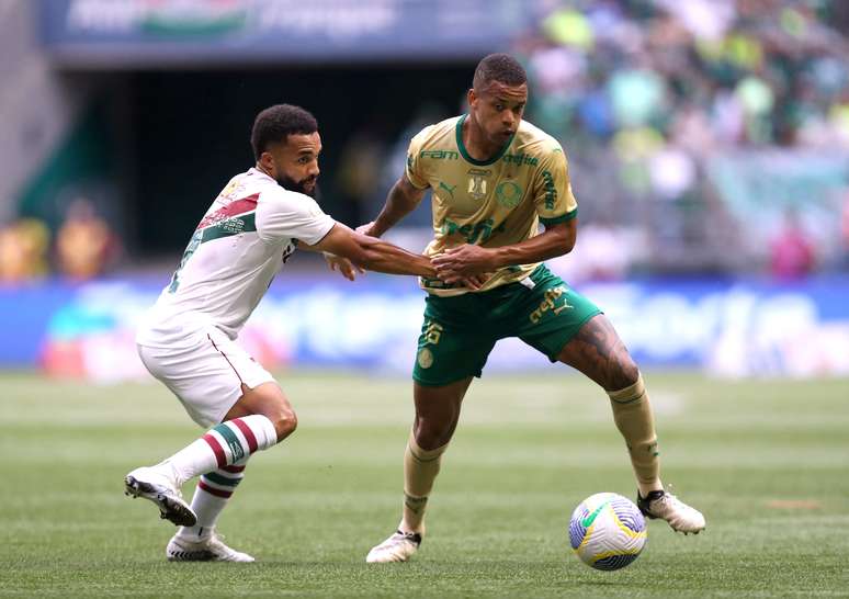 Palmeiras' Caio Paulista in action with Fluminense's Samuel Xavier