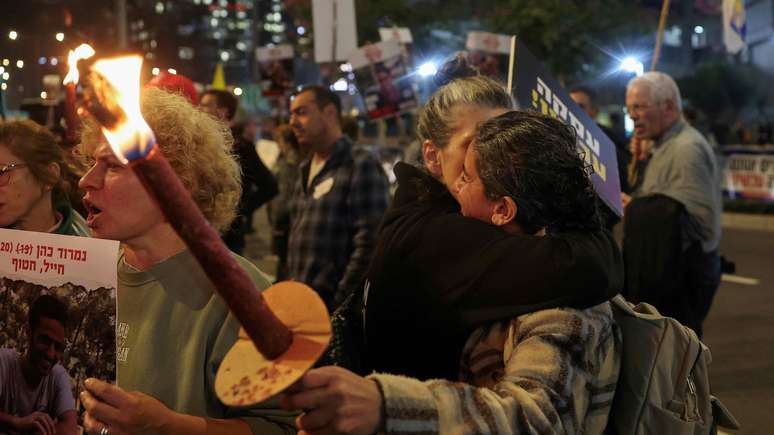 Manifestantes que pedem libertação de reféns e fim da Guerracomo ganhar dinheiro na bet nacionalGaza celebramcomo ganhar dinheiro na bet nacionalTel Aviv,como ganhar dinheiro na bet nacionalIsrael