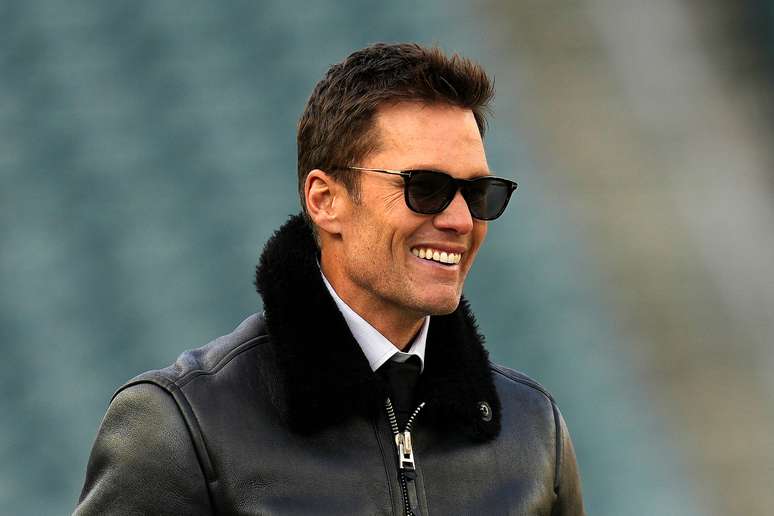 Mantan pemain Tom Brady tersenyum