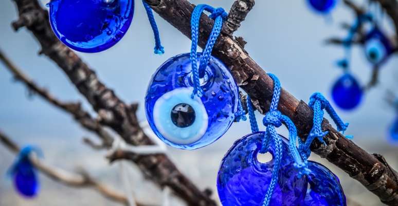 How did the Greek eye become a symbol of envy and protection of evil eyes?