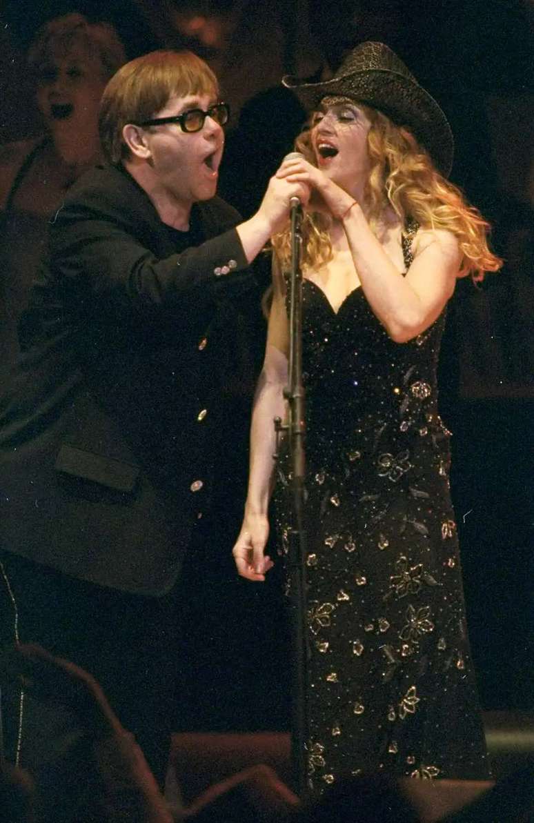 Elton John and Madonna do a duet at finale of the Rain Forest Concert at Carnegie Hall.