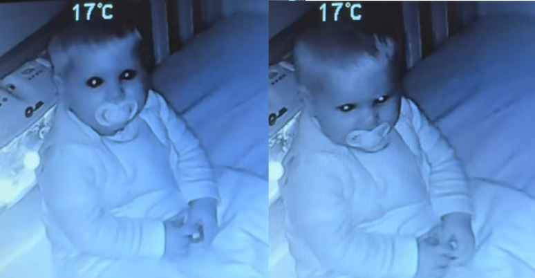 Bebê encara a câmera de babá eletrônica antes de dormir