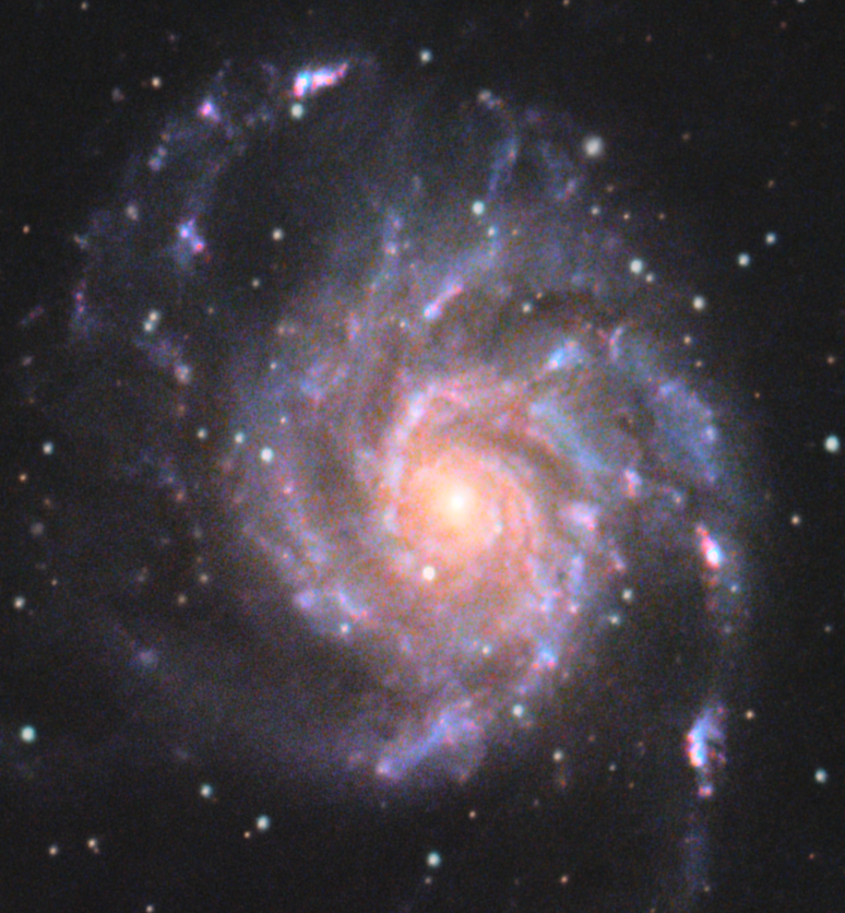 Uma foto do espa&ccedil;o sideral que mostra uma gal&aacute;xia com o formato de um cata-vento.