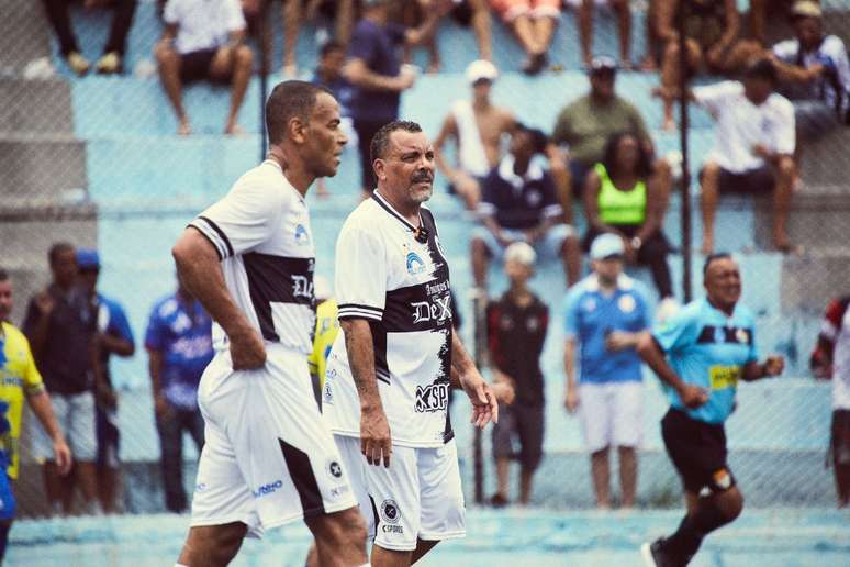 Cafu playing in rapper Dexter's team. Both love football and are involved with social causes.