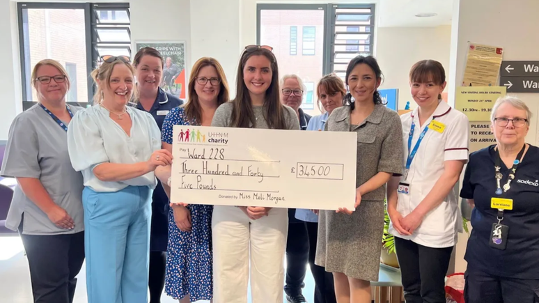 Moli Morgan and the family delivered a check to the hospital team