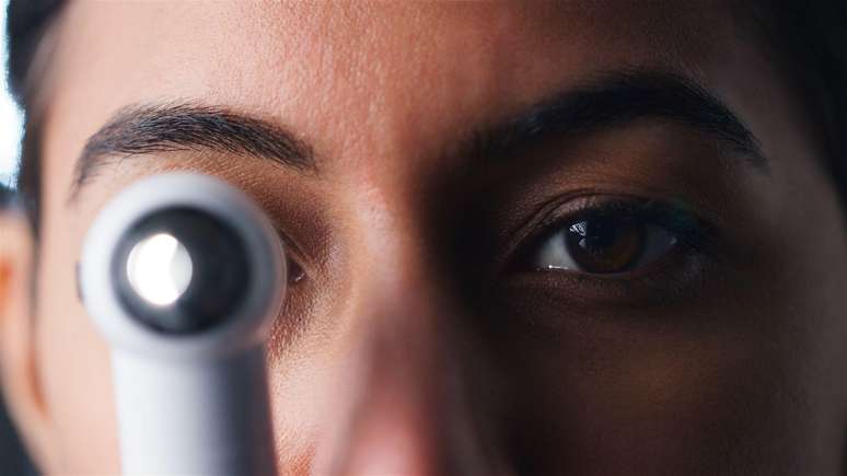 Why does methanol poisoning cause blindness?