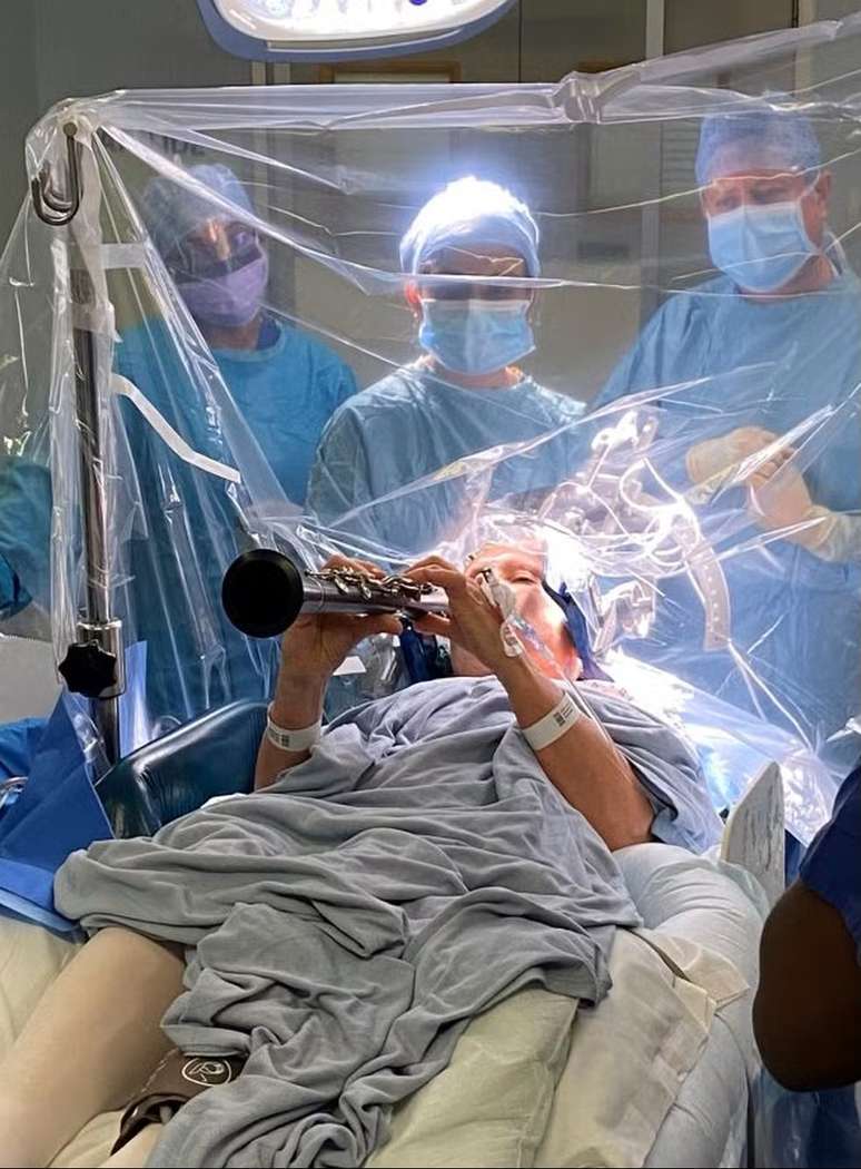 A British woman with Parkinson’s recovers movement and returns to playing the clarinet during surgery