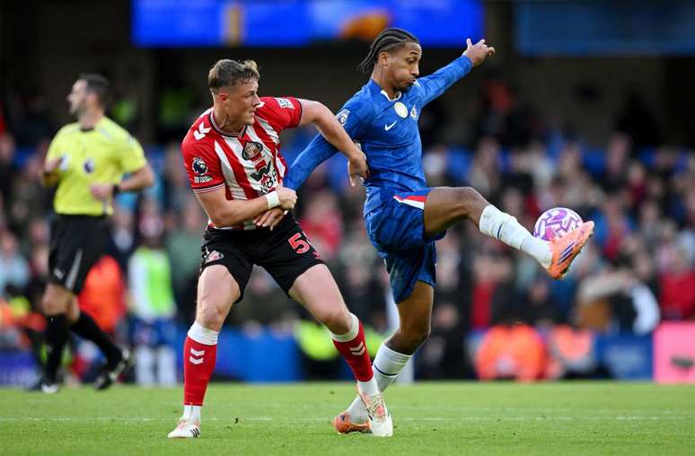 Joaõ Pedro, a Brazilian from Chelsea (in blue) and the Brazilian team, receives Ballard's mark Joaõ Pedro, a Brazilian from Chelsea (in blue) and the Brazilian team, receives Ballard's mark
