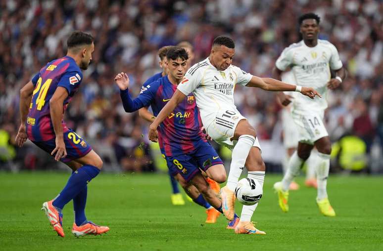 Real Madrid CF v FC Barcelona &ndash; LaLiga EA Sports MADRID, SPAIN &ndash; OCTOBER 26: Kylian Mbappe of Real Madrid scores a goal whilst under pressure from Eric Garcia of FC Barcelona, which is later disallowed following an offside decision via a VAR Review, during the LaLiga EA Sports match between Real Madrid CF and FC Barcelona at Estadio Santiago Bernabeu on October 26, 2025 in Madrid, Spain. (Photo by Angel Martinez/Getty Images)