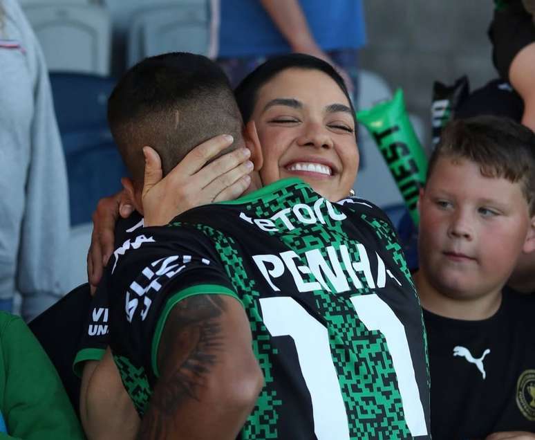 Daniel Benha with his wife at a match in Australia