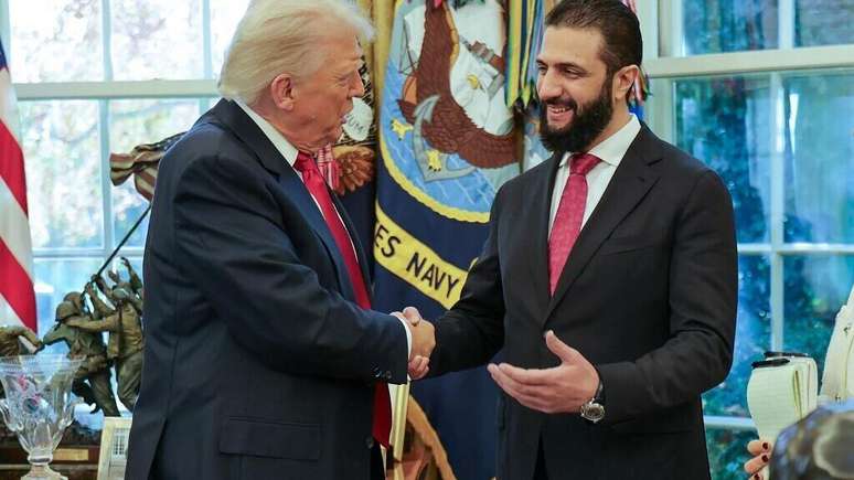 A photo published by the Syrian Arab News Agency (SANA) on November 10, 2025 shows former US President Donald Trump (left) receiving interim Syrian President Ahmed al-Sharaa at the White House in Washington.