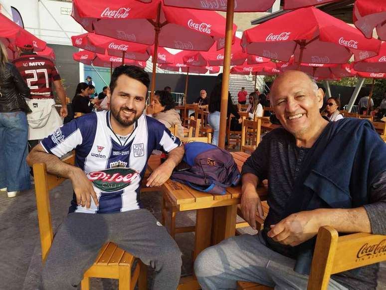 Roberto Bai and Roberto Filho enjoy the fan zone in Lima.