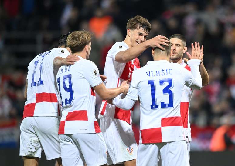Jogadores da Croácia comemorando o terceiro gol 